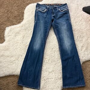 Rock Revival Denim Jeans with Gold Accents.